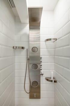 Modern white tiled shower room with chrome shower