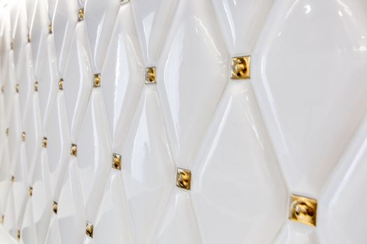 Modern decorative white tile closeup. Decorative background with white tiles on the wall.