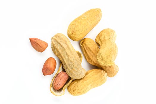 Top view of dried peanuts isolated on the white background in close-up