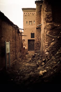 Door of a Kasbah between lonely ruins