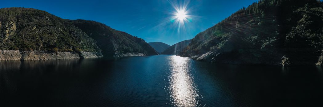 Aerial shot of river Navia in northern spain with sun and no clouds