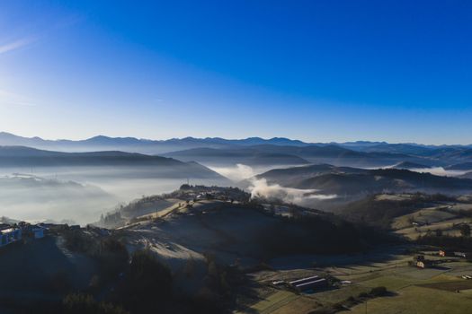 Landscape of fog and mountains in a clear day