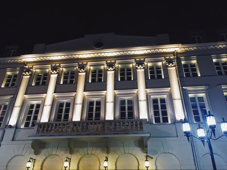 Exterior facade of classic building in the European city at night, architecture and design detail