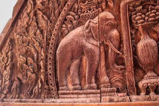 Elephant depiction.Piece of wood curving art, Isolated vintage pattern curved in wood