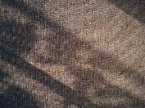 Linen texture and shadows as rustic background, fabric and material