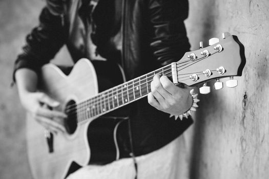 musician young girl with red hair with an acoustic guitar