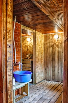 interior a rustic bath with blue tub