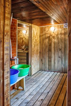 interior a rustic bath with two blue and green tubs