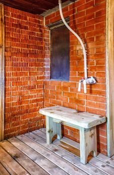 interior a rustic bath with wooden bench