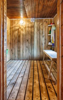 interior a rustic bath with wooden bench