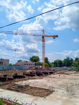 Construction of a new building, the Big Tower Crane on the construction site.