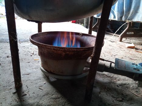 Work gas burner. Gas burner under the smokehouse tank.