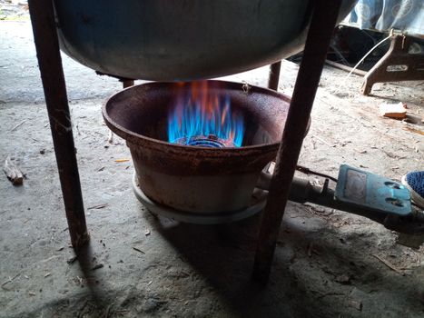 Work gas burner. Gas burner under the smokehouse tank.