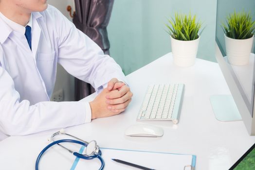 Medicine doctor's working on desk. Closeup of Stethoscope. Physician man video call sit hand in hand and listen patient explain on front laptop computer at hospital office, Healthcare medic concept