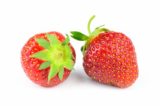 Two ripe whole strawberries isolated on a white background in close-up