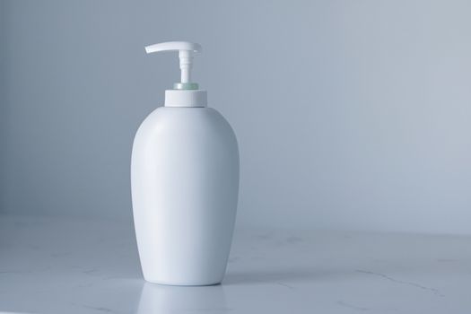 Blank label cosmetic container bottle as product mockup on gray background, hygiene and healthcare