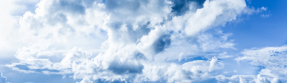 Fantastic soft clouds against blue sky, Panoramic white fluffy clouds in the blue sky