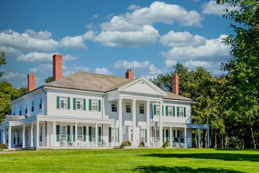 White Colonial with Green Shutters in Canada