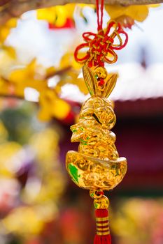 Golden hare, chinese New Year decoration. Symbols of luck and protection. Cambodia.
