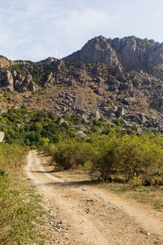 Path to famous "Ghost Valley" with strangly shaped rocks. Demerdji mountains. Crimea, Russia.