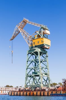 Port crane in South Bay of Sevastopol. Clear sunny autumn day. Crimea, Russia.