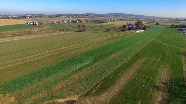 Aerial View of Amish Farm Countryside in Autumn from a Drone
