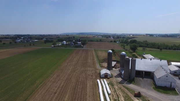 Aerial View of Amish Farm Countryside in Autumn from a Drone