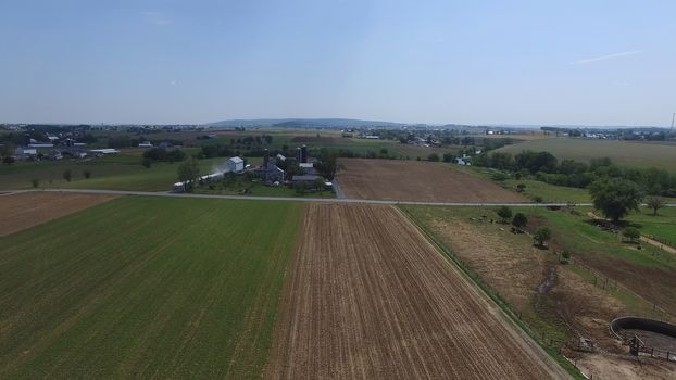 Aerial View of Amish Farm Countryside in Autumn from a Drone