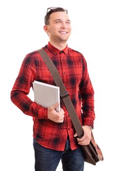 Portrait of a smiling young man in stylish plaid shirt with a shoulder bag holding a notebook, isolated on white background. Male student holding a book. Education concept.