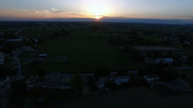 Aerial View of a Sunset on a Summer Day in Amish Countryside as Seen by a Drone