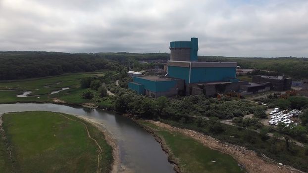 Aerial View of an Abandoned Nuclear Power Plant as Seen by a Drone on a Summer Day
