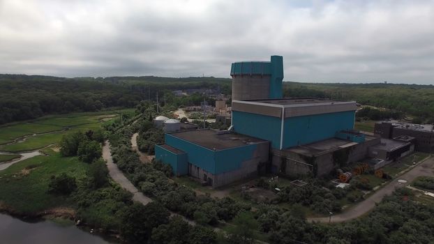 Aerial View of an Abandoned Nuclear Power Plant as Seen by a Drone on a Summer Day