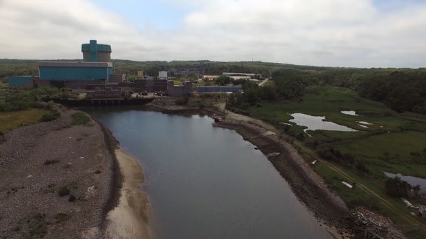 Aerial View of an Abandoned Nuclear Power Plant as Seen by a Drone on a Summer Day