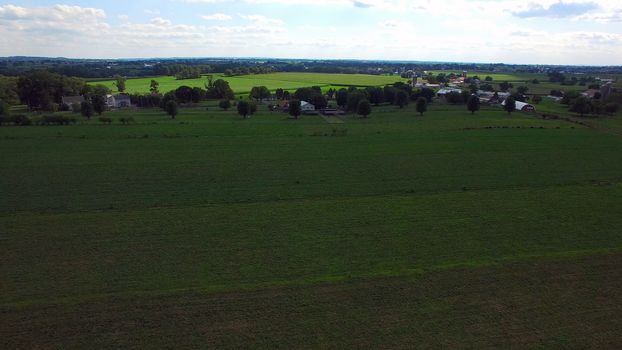 Aerial View of Amish Farm Countryside in Autumn from a Drone