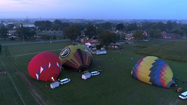 Lancaster, Pennsylvania, September 2018 - Aerial View of Sunrise with Hot air Balloons Taking Off with Glow as Seen by a Drone