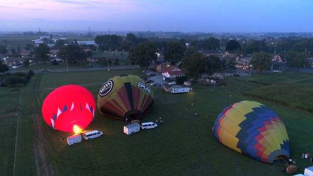 Lancaster, Pennsylvania, September 2018 - Aerial View of Sunrise with Hot air Balloons Taking Off with Glow as Seen by a Drone