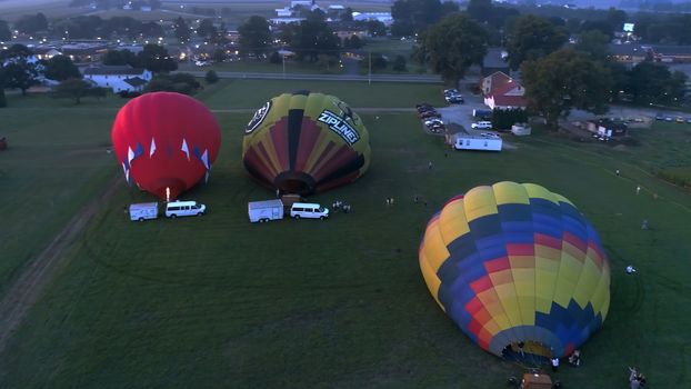 Lancaster, Pennsylvania, September 2018 - Aerial View of Sunrise with Hot air Balloons Taking Off with Glow as Seen by a Drone