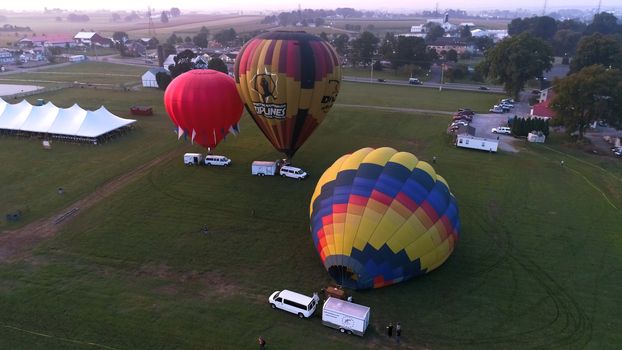 Lancaster, Pennsylvania, September 2018 - Aerial View of Sunrise with Hot air Balloons Taking Off with Glow as Seen by a Drone