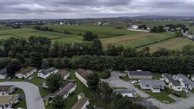 Aerial View of Amish Farm Countryside in Autumn from a Drone