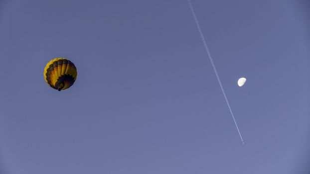 Hot Air Balloon with Moon in Amish Countryside in the Autumn