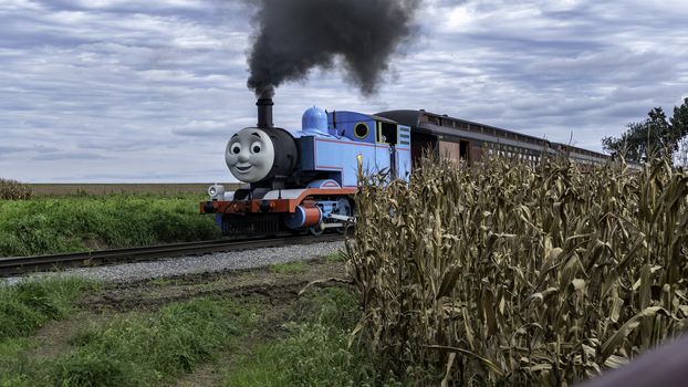 Strasburg, Pennsylvania, September 2018 - Thomas the Train Puffing along Amish Countryside on a Sunny Autumn Day