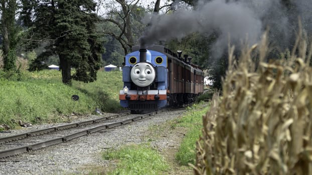 Strasburg, Pennsylvania, September 2018 - Thomas the Train Puffing along Amish Countryside on a Sunny Autumn Day