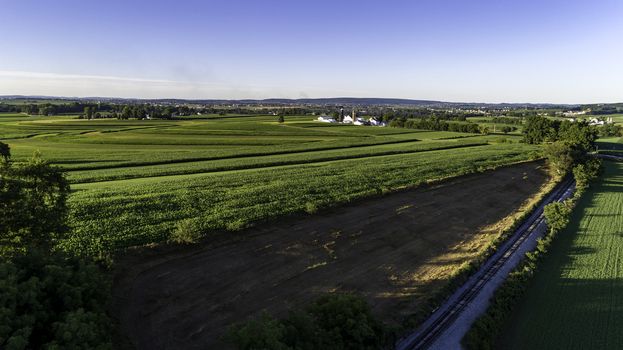 Aerial View of Amish Farm Countryside in Autumn from a Drone