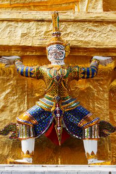 Sculpture in Royal Palace, Bangkok, Thailand. Wat Phra Keo. Architecture detail - statue of mythical creature with green skin.