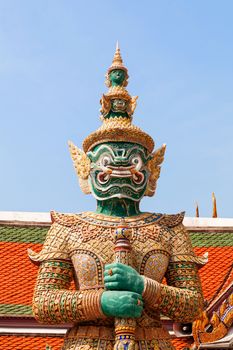 Sculpture in Royal Palace, Bangkok, Thailand. Wat Phra Keo. Architecture detail - statue of mythical creature with green skin.