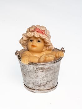 Miniature depicting a baby bathing in a bucket, vertical image