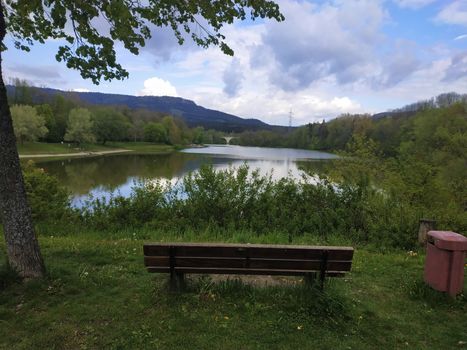 A bench in front of a lake spotted in Germany