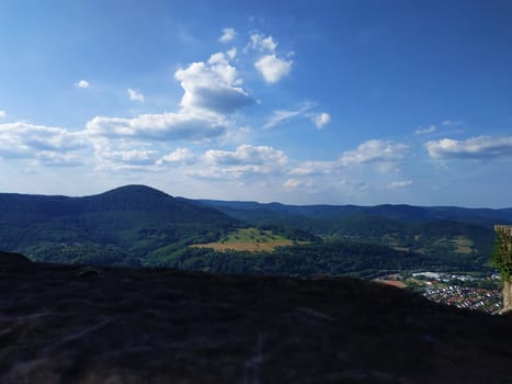 View over beautiful hilly landscape with dramatic cloudscape