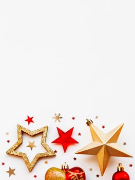 Christmas and New Year 2020 background with decorations, shaped as a circle. Golden and red balls, stars, confetti and heart.