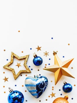 Christmas and New Year 2020 background with decorations, shaped as a circle. Golden and blue balls, stars, confetti and heart.